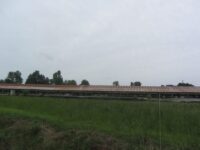 old-chicken-coops-from-distance-NWA-Arkansas-scaled