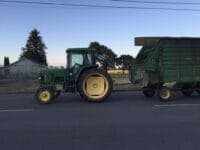 Tractor-driving-through-Smith-River-CA-2016-scaled
